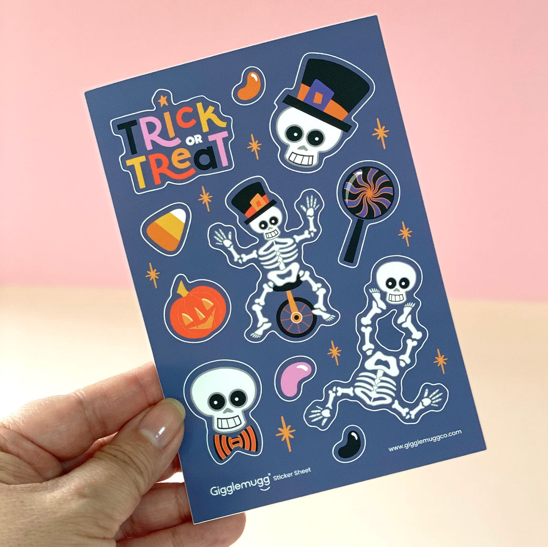 Halloween Trick-or-Treat sticker sheet featuring playful skeletons doing tricks along with some treats designed by Gigglemugg