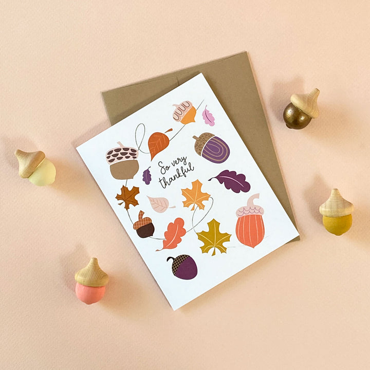 Thanksgiving thank you card with illustrated Autumn leaves and acorns design by Gigglemugg