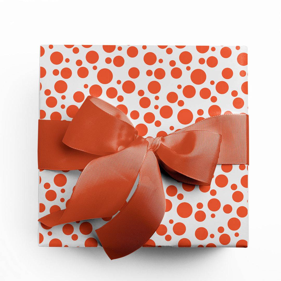 Gift wrapped in fun orange polka dot wrapping paper by Gigglemugg.