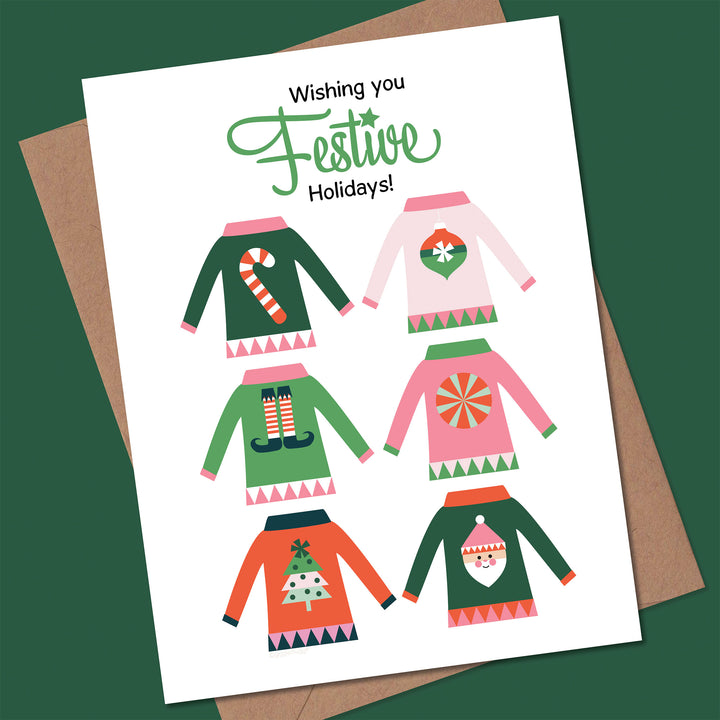 Card with festive Christmas sweaters and &