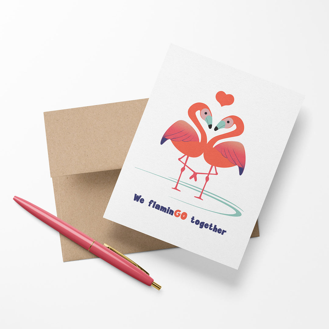 Greeting card with two flamingos and a heart, with text &