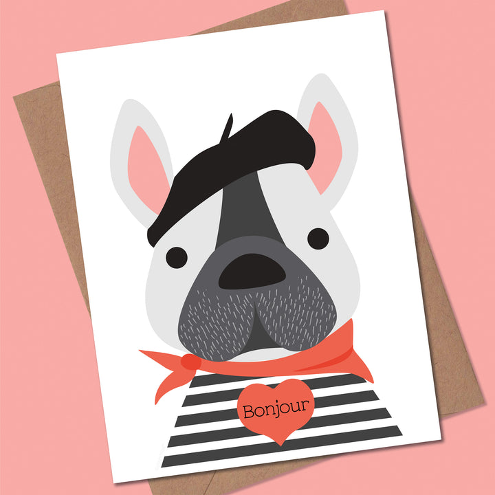 Card with a cartoon dog wearing a beret and striped shirt on a pink background