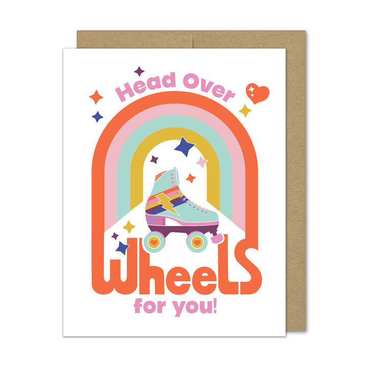 Greeting card with rainbow design and roller skate, featuring text &