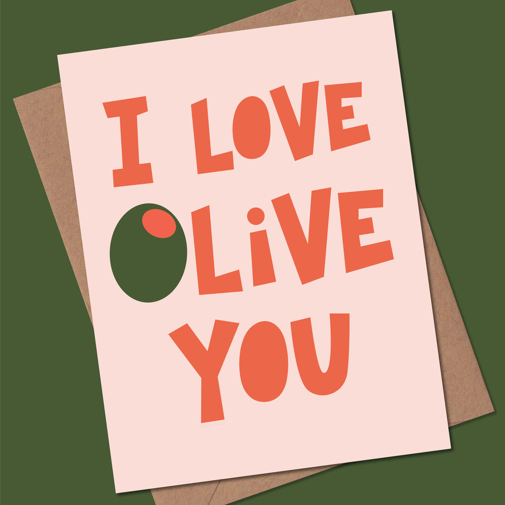 Greeting card with the words, "I love olive you" on a pink background with a Kraft envelope.