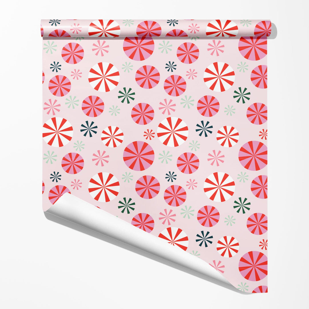 Christmas wrapping paper with a pink peppermint pattern design by Gigglemugg