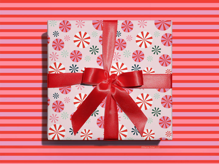 Holiday wrapping paper with a modern, pink peppermint pattern design by Gigglemugg