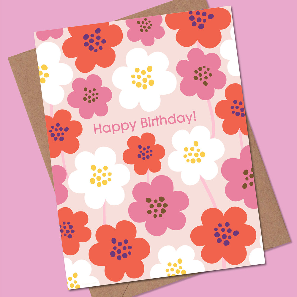 Floral birthday card with colorful flowers on a pink background