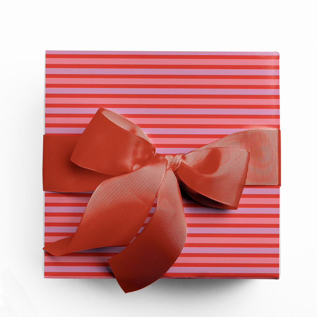 Gift wrapped in pink and red stripe wrapping paper by Gigglemugg.