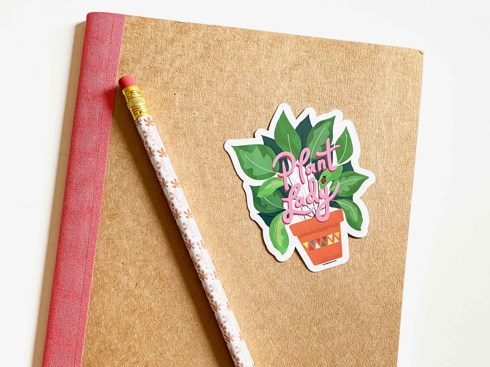 Noteook with floral pencil and plant lady house plant sticker by Gigglemugg.