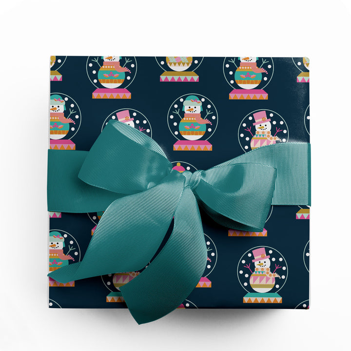 Holiday gift wrapped in colorful winter snowman wrapping paper by Gigglemugg.