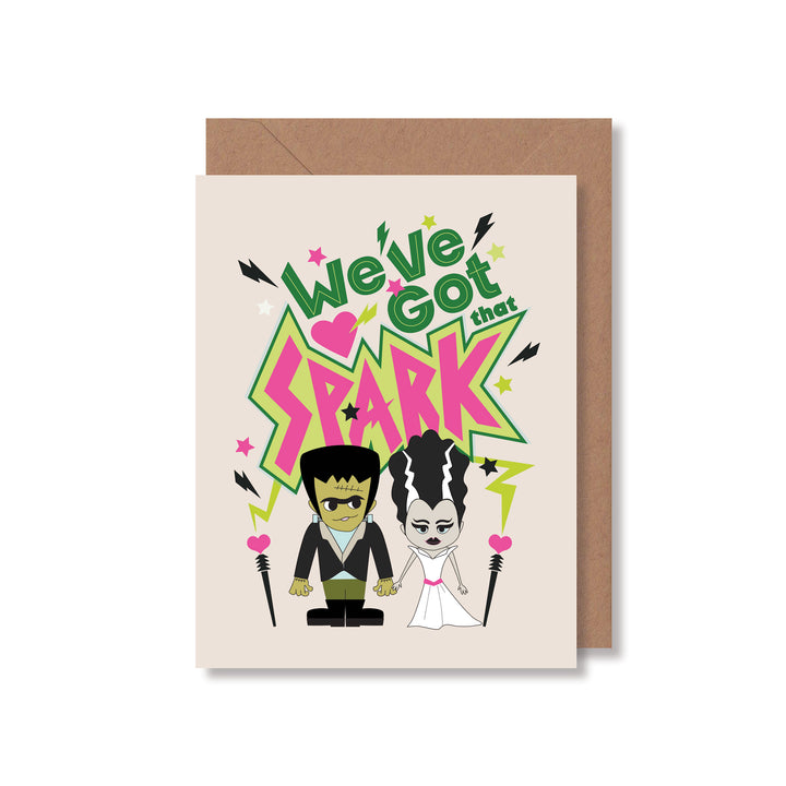 Love greeting card featuring a fun Frankenstein and his bride illustration and hand-lettered saying, "We've got that spark" by Gigglemgg®.