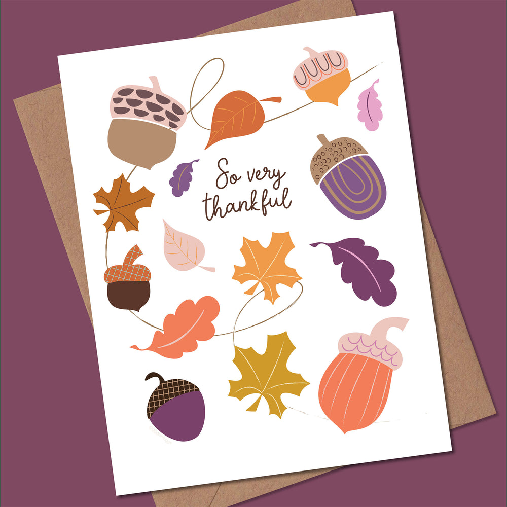 Greeting card with autumn-themed illustrations and 'So very thankful' text on a purple background.