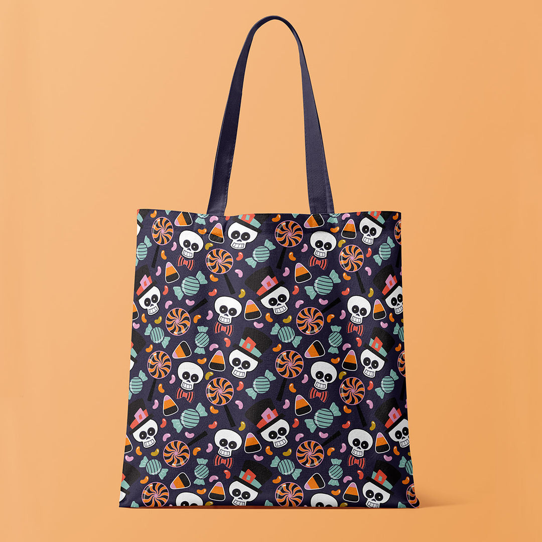 Trick-or-treat tote bag with a Halloween candy pattern on an orange background designed by ©Gigglemugg