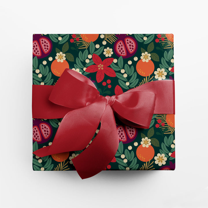 Gift wrapped in winter floral holiday wrapping paper with red ribbon.
