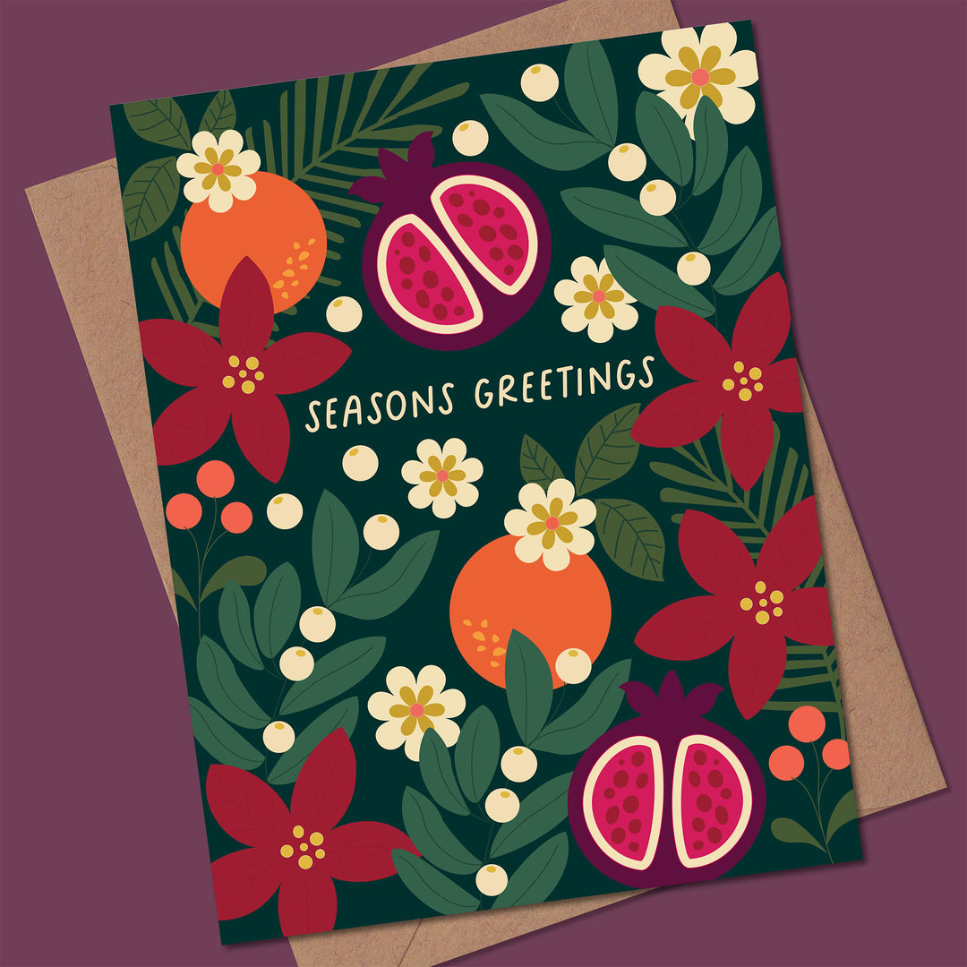 Greeting card with festive design featuring pomegranates, oranges, and flowers on a dark green background.
